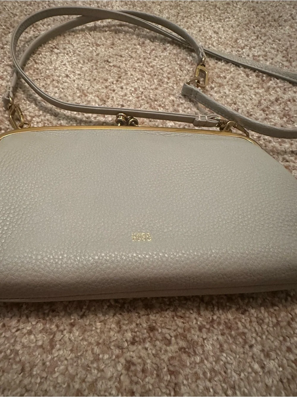 HOBO Pebbled Leather Clutch in Light Gray with Gold Trim